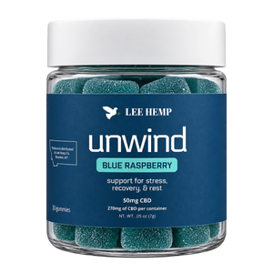 A jar of Lee Hemp Unwind CBD gummies in Blue Raspberry flavor, featuring teal-colored gummies visible through a clear glass jar with a white lid and a dark blue label.